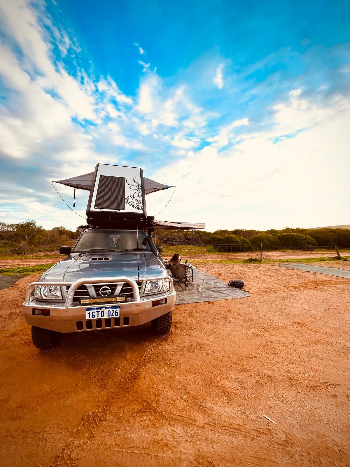Toby Allen’s Nissan Patrol parked on a red dirt road in the Australian outback.