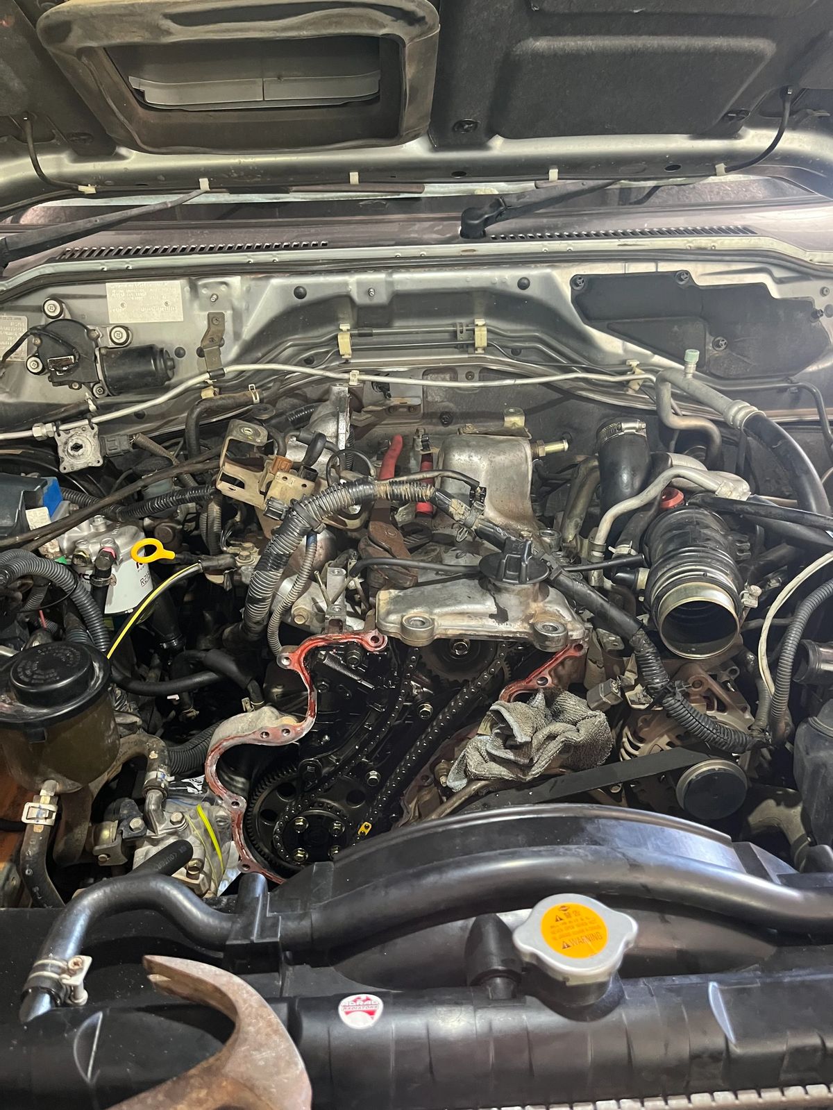 Close view of the Nissan Patrol engine bay during maintenance.