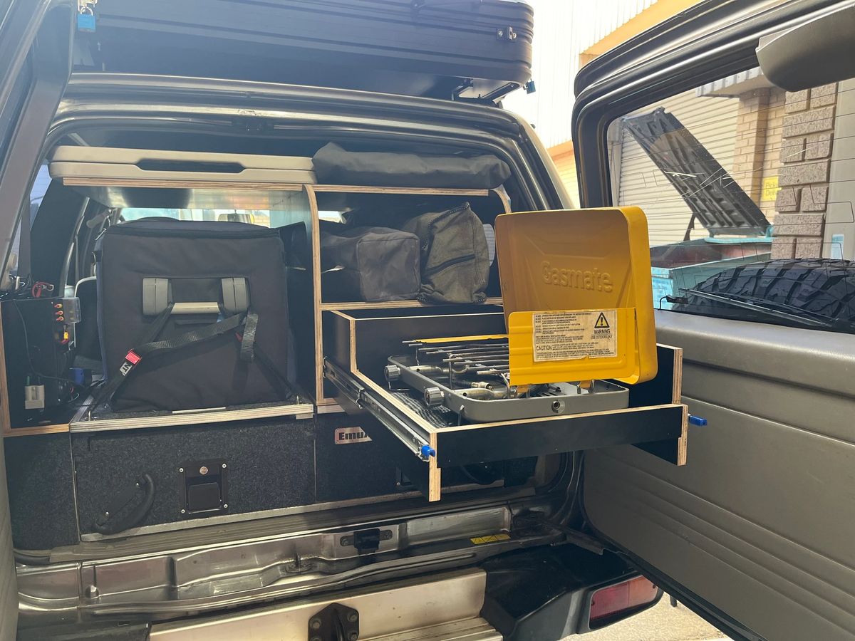 Custom drawers and work surface inside the Nissan Patrol camper.